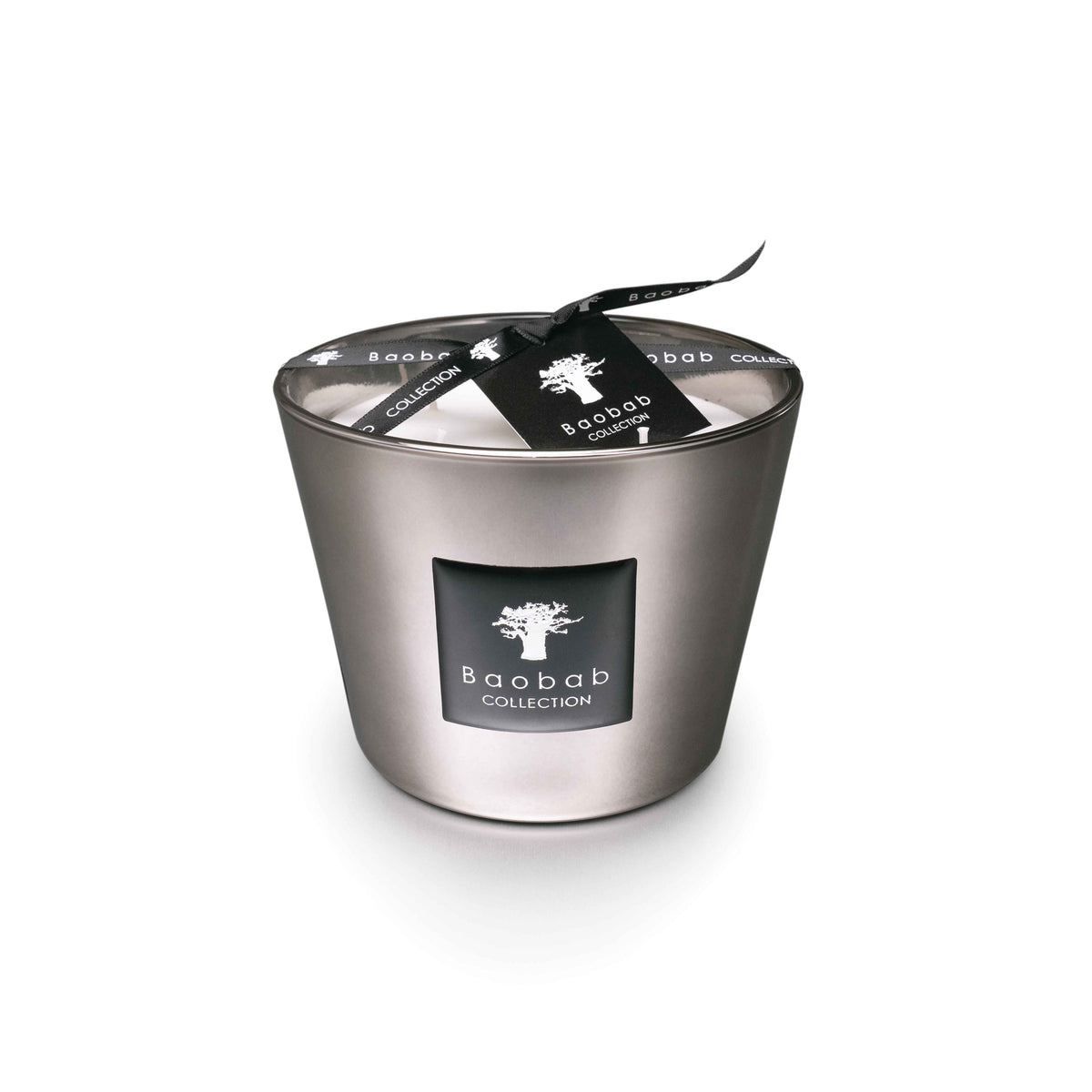 Platinum-colored cylindrical candle with black label, lid, and black ribbon bow from Baobab Collection.