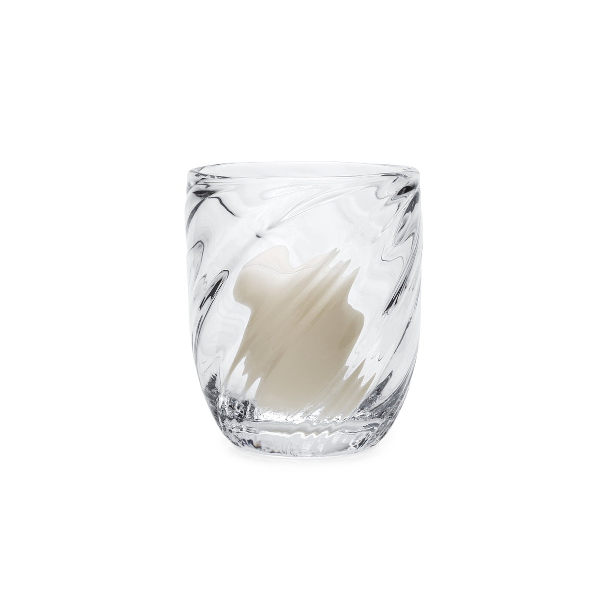 Clear glass votive holder with swirled gray pattern containing white pillar candle.