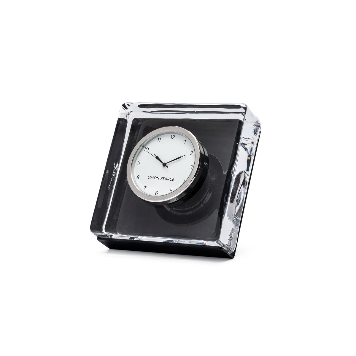 Square desk clock with white face and black hands, mounted in clear acrylic case with black base.