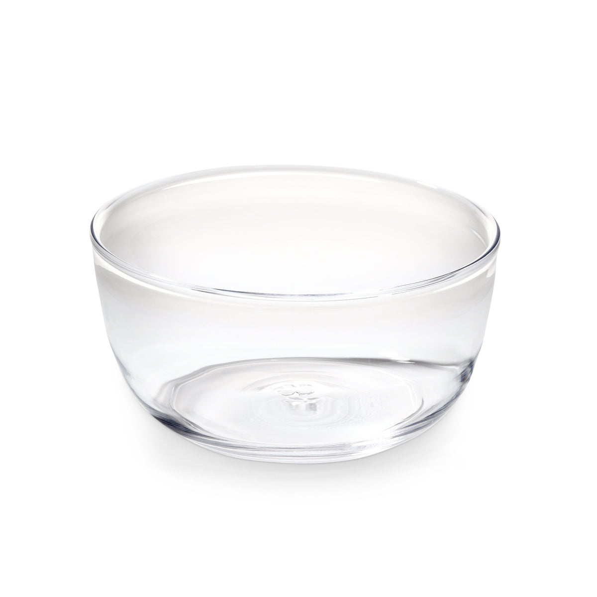 Clear glass bowl with wide curved sides and flat bottom.