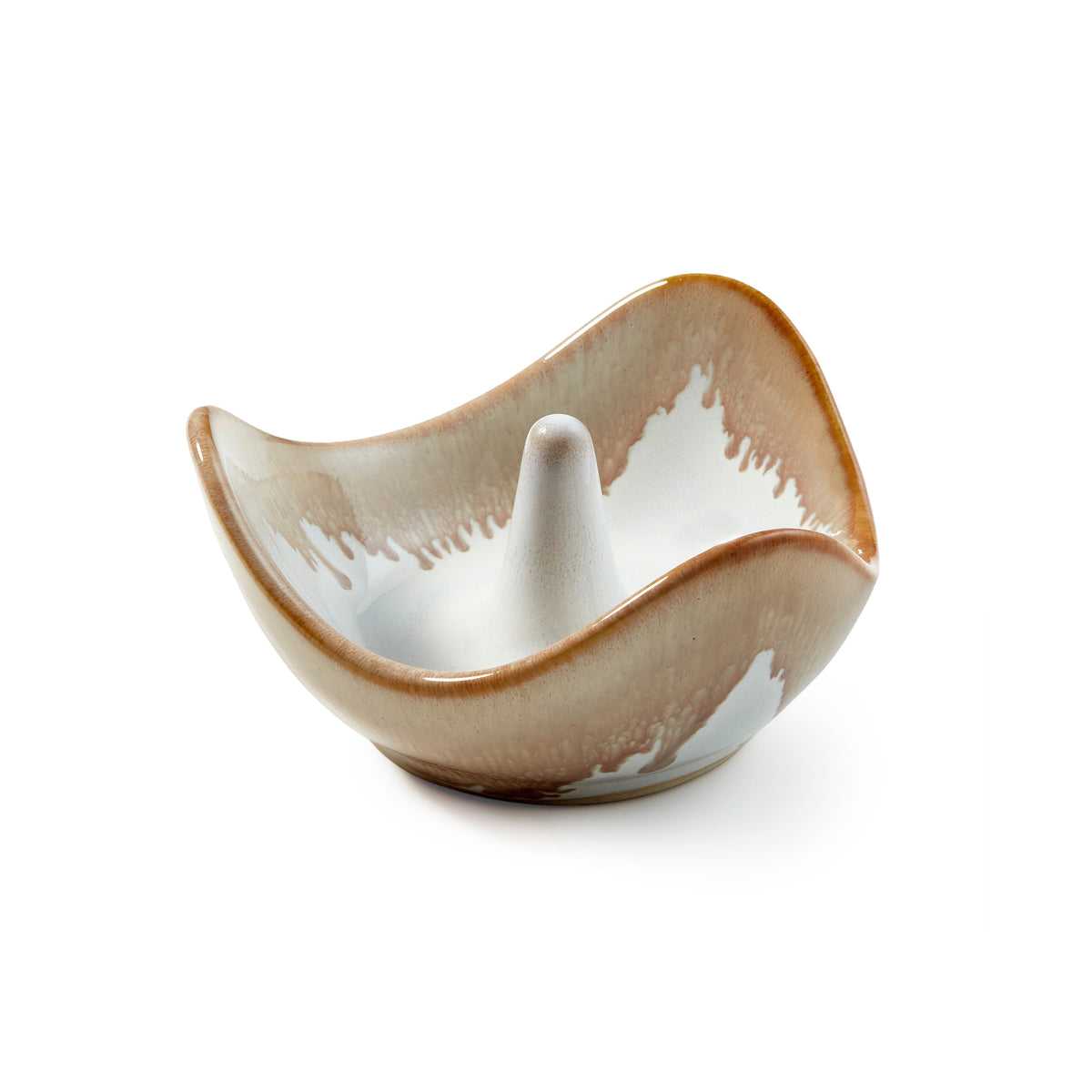 Ceramic ring holder with wavy bowl shape in tan and white glaze with central cone post.