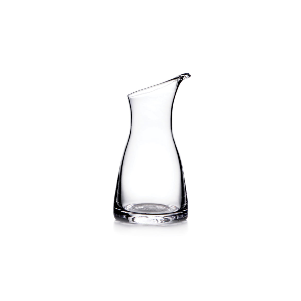 Clear glass carafe with curved sides and a pouring spout at the top.