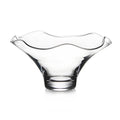Clear glass bowl with wavy rim and pedestal base.