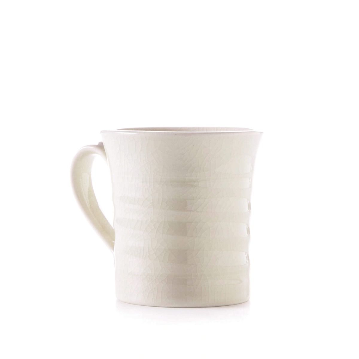 Ivory ceramic mug with crackle texture finish and curved handle.