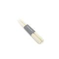 Two ivory taper candles bundled together with a gray paper band labeled "Smith Nowak."