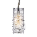 Clear glass cylindrical pendant with textured horizontal lines and warm Edison-style bulb, suspended by dark cord.