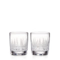 Two clear double old-fashioned glasses with engraved forest and mountain design around the lower portion.