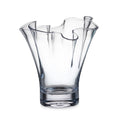 Clear glass vase with wavy ruffled rim and four petal-shaped openings at the top.