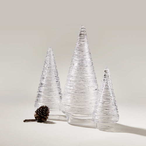 Set of three clear glass cone-shaped decorative trees with textured surfaces and a pinecone accent.