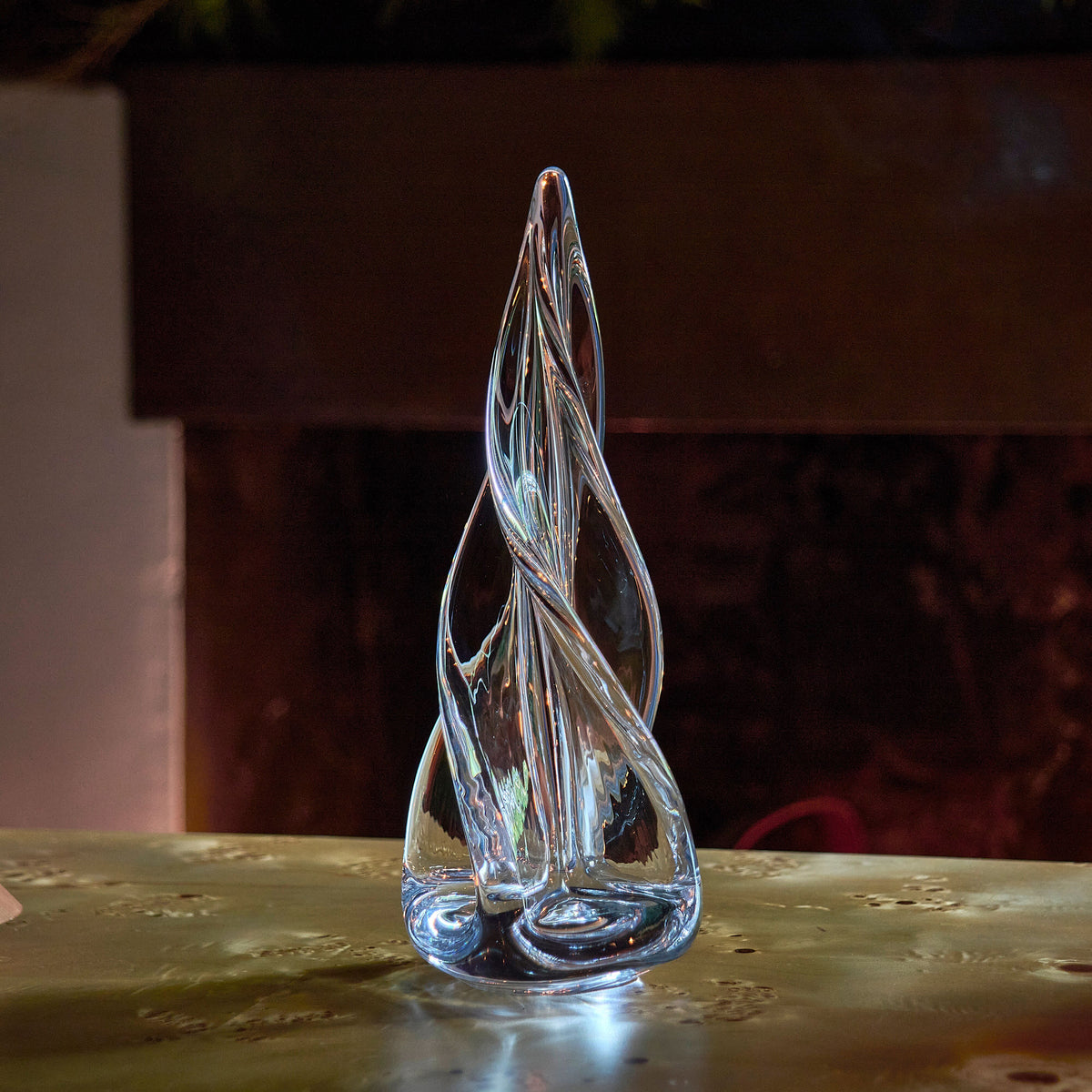 Clear glass spiral tree sculpture with four-sided tapered form and pointed top, approximately 16 inches tall.